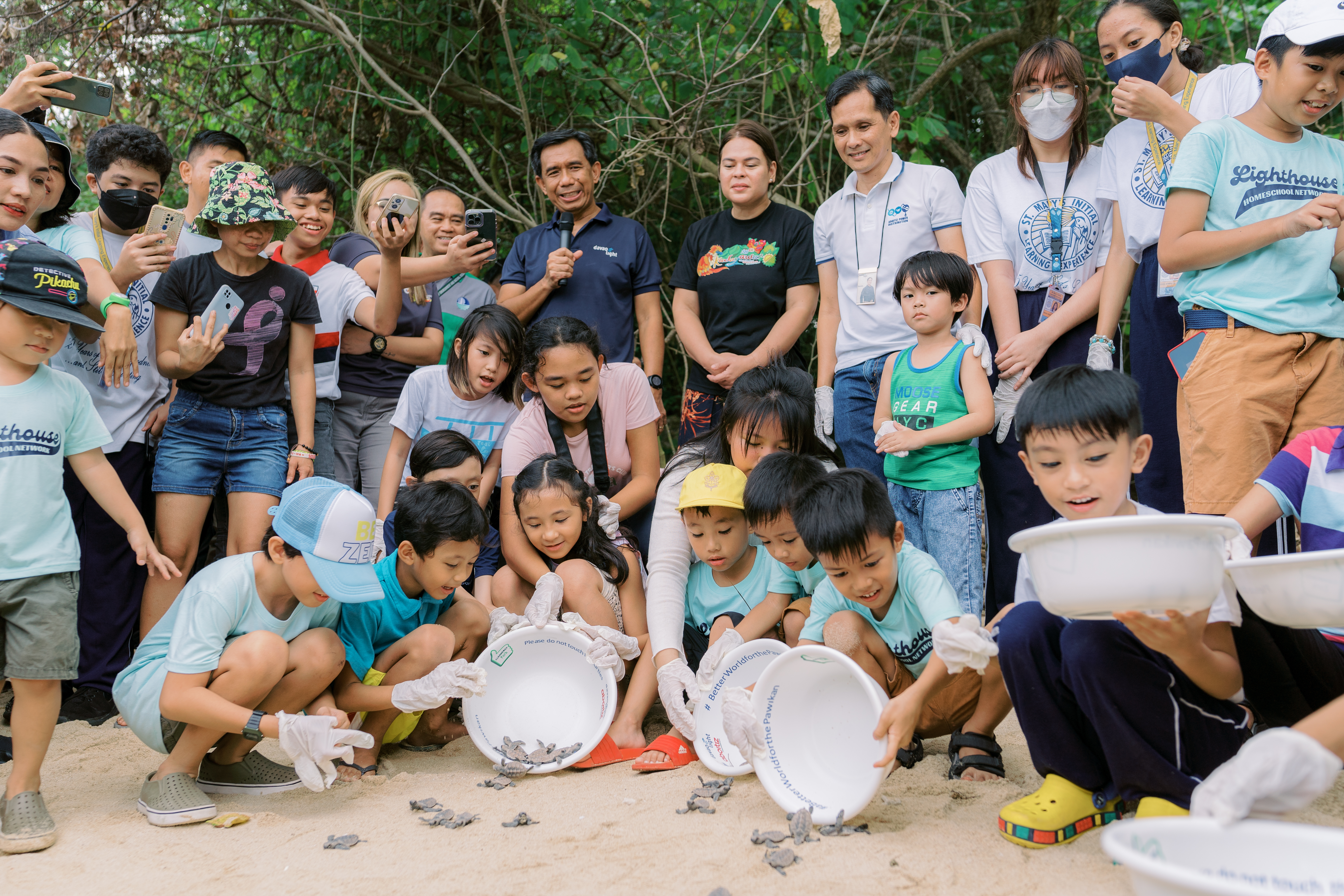 VP Duterte with schools, government offices, and NGOs release turtle hatchlings at Cleanergy Park