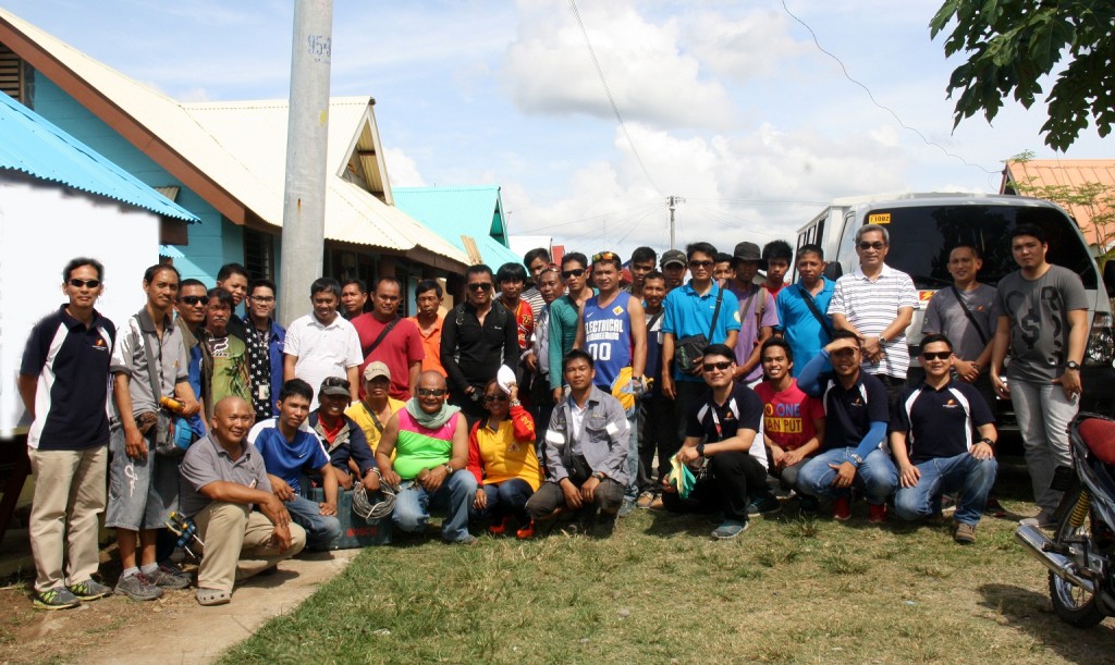 Davao Light and Power Co. EVP and COO Arturo M. Milan (3rd from right, standing) together with the Davao Light employees and the volunteer-electricians from six different accredited associations in Davao and Panabo cities pose during the Gawad Kalinga House Wiring at the newest Sweet Home Alabama- Gawad Kalinga Village located at the Relocation Area, Los Amigos, Tugbok, Davao City last February 13, 2016. Also in the photo are Community Relations Manager Fermin Edillon (leftmost, standing) and Customer Retail Services Department headed by Manager Engr. Mervin Dalian (7th from left, standing).