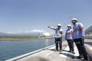 BEYOND THE HORIZON. Engineers at the baseload facility operated by AboitizPower subsidiary Therma South, Inc. (TSI) in Davao City look toward the horizon, an act symbolic of the AboitizPower Group’s forward-looking mindset in 2021.