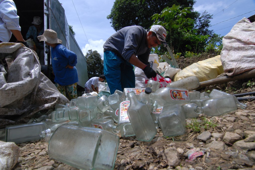 Residents of Barangay Bineng, adults and children alike sell their recyclable garbage to the Ecomarket Day organized by Hedcor. The program helps the residents of the far flung areas clear their yards of garbage and earn from it.