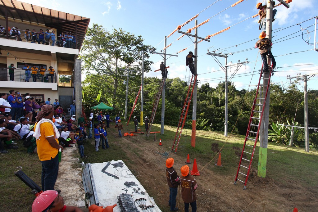 Linemen from different VECO contractors compete against each other during the lineman